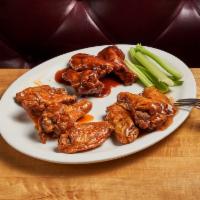 Jumbo Wings (10 Pieces) · Choice of buffalo, honey BBQ, or sweet and sour. Served with ranch or blue cheese dressing.