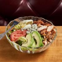 Cobb Salad · Grilled chicken breast, avocado, crumbled bleu cheese, bacon, sliced egg, and tomato on a be...