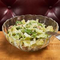 Caesar Salad · Romaine lettuce with homemade croutons, grated Parmesan cheese, and creamy Caesar dressing.