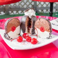 Tartuffo · Tartufo is an Italian ice cream dessert  composed of two or more flavors of ice cream, often...