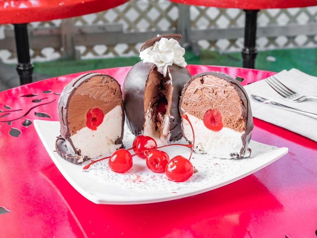 Tartuffo · Tartufo is an Italian ice cream dessert  composed of two or more flavors of ice cream, often with either fruit syrup or frozen fruit — typically raspberry, strawberry, or cherry — in the center. 