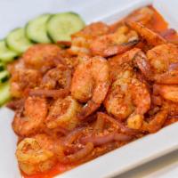 Camarones Pechas · 18 shrimp sauteed with cucumbers and onions. Served with rice.