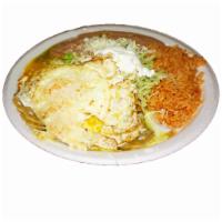 Huevos Rancheros · Eggs topped with ranchero sauce, served with rice and beans.