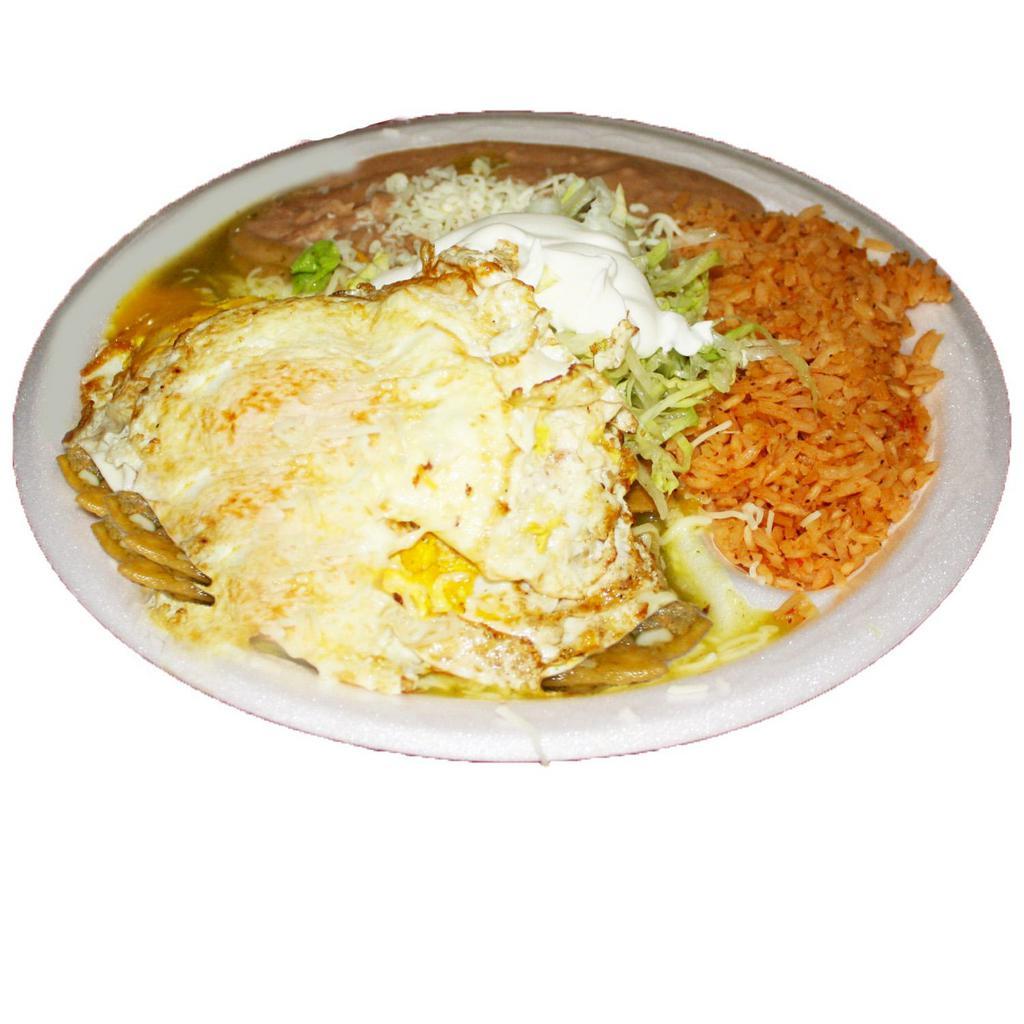 Chilaquiles con Huevo · Eggs and Fried tortilla chips in your choice of red or green sauce, served with rice and beans.