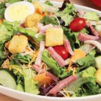 Chef Salad · Lettuce, tomato, salami, ham, onions, olives, cheese and croutons.