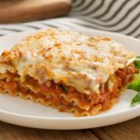 Lasagna · Choice of meat or veggie. Includes salad and garlic knots.