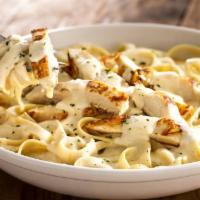 Fettucini Alfredo chicken  · Served with chicken. Includes salad and garlic knots.