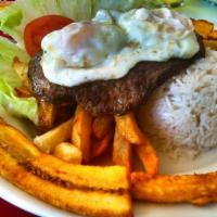 Bistec a lo Pobre · Steak accompanied with fried potatoes, fried eggs, fried plantains, served with rice and sal...