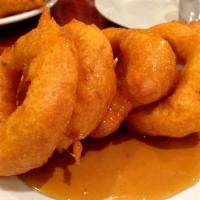 Picarones · Sweet potato and squash fried doughnuts topped with fig syrup.