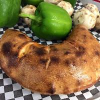 Meat Calzone · Pepperoni, Canadian bacon, Italian sausage and ground beef.