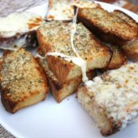 Garlic Bread · Slices of Italian bread, thick cut with our homemade garlic butter. Add cheese for an additi...