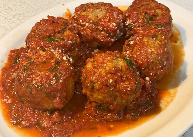 Meatballs  · Home-made meatballs made with beef and vile. Seasoned with home-made breadcrumbs with Romano cheese. Coked in our signature tomato sauce. Full size six meatballs, half-portion three meatballs. Served over pasta: linguine or penne. 