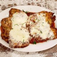 Chicken Parmigiana · Large chicken cutlets breaded in house made breadcrumbs over-homemade tomato sauce topped wi...