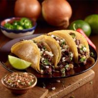 Classic Street Taco · Corn or flour tortilla. Choice of filling, cilantro, onion and lime.