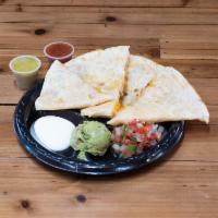 Quesadilla · Made with cheese and your choice of filling. Includes your choice of pico de gallo, sour cre...