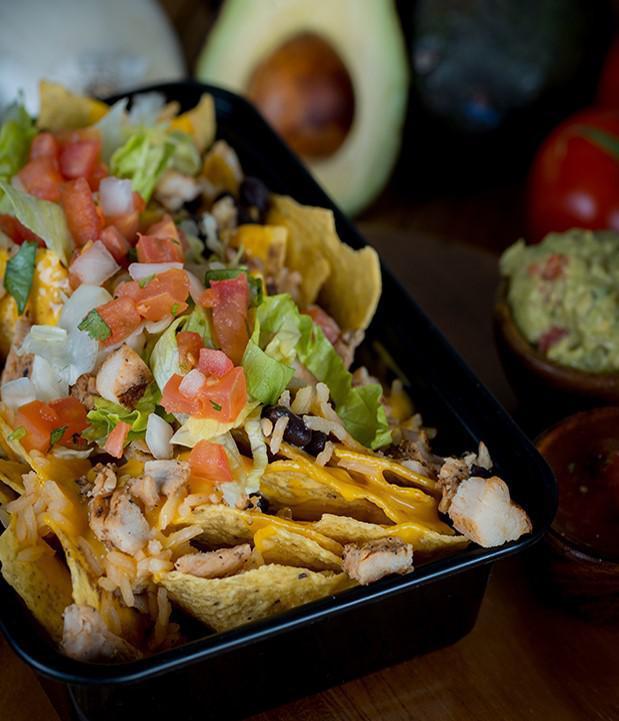 Nachos · Tortilla chips topped with choice of filling, beans, queso and salsa. Toppings include pico de gallo, lettuce and jalapeno.