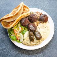 Veggie Combo Plate · A vegetarian Delight featuring, falafel, hummus, babaganoush, tabuli, dolmas, cooked fava an...
