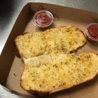 Garlic Bread · 8 in garlic bread cut in four with 2 sides of sauce.