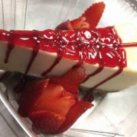 Straw-Buried Cheesecake · New York baked cheesecake buried in delicious strawberries.