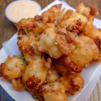 Fried Cheese Curds · Murray's beer-battered cheese curds served with Buffalo sauce or Sriracha ranch dressing.