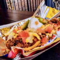 Frito Pie · Fritos served with house-made chili, topped with shredded queso, sour cream, and pickled jal...