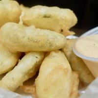 Shiner Fried Pickles · Shiner bock beer-battered pickle chips served with our creamy Sriracha ranch dressing.