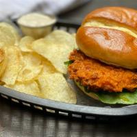 Buffalo Chicken Sandwich · Buttermilk fried chicken coated in Buffalo sauce with crispy romaine and Cotija ranch. Add f...