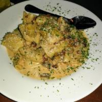 Rigatoni Pasta · Fresh rigatoni, grilled chicken, bacon, mushrooms and shallots in a sherry cream sauce.