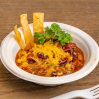 Tortilla Soup · Slow cooked tortilla soup with beans, grilled peppers and onions, fresh cilantro, cheese, fr...