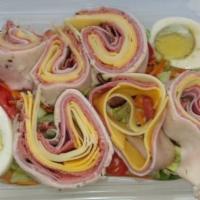 24. The Chef's Salad · Iceberg, romaine lettuce with sliced egg, turkey, ham, roast beef, tomato, peppers, red onio...