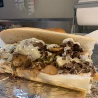 53. The Turnpiker  · Cheese steak, grilled peppers and onions with melted provolone cheese.