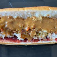 64. The Hot Gobbler · Hot turkey with stuffing gravy and cranberry sauce.