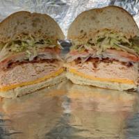 Spicy Adventure · Chipotle' Chicken, Cheddar Cheese, Chipotle' Mayo, Bacon, Lettuce, Tomato and Onion Toasted!