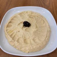 Hummus · Chickpeas mashed into a paste with lemon juice, olive oil, and flavored with tahini.