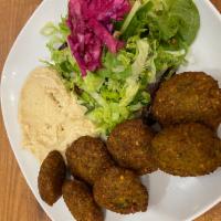 Falafel with Hummus · 7 pieces. Lightly fried vegetable balls made of chickpeas with celery, garlic parsley, cilan...