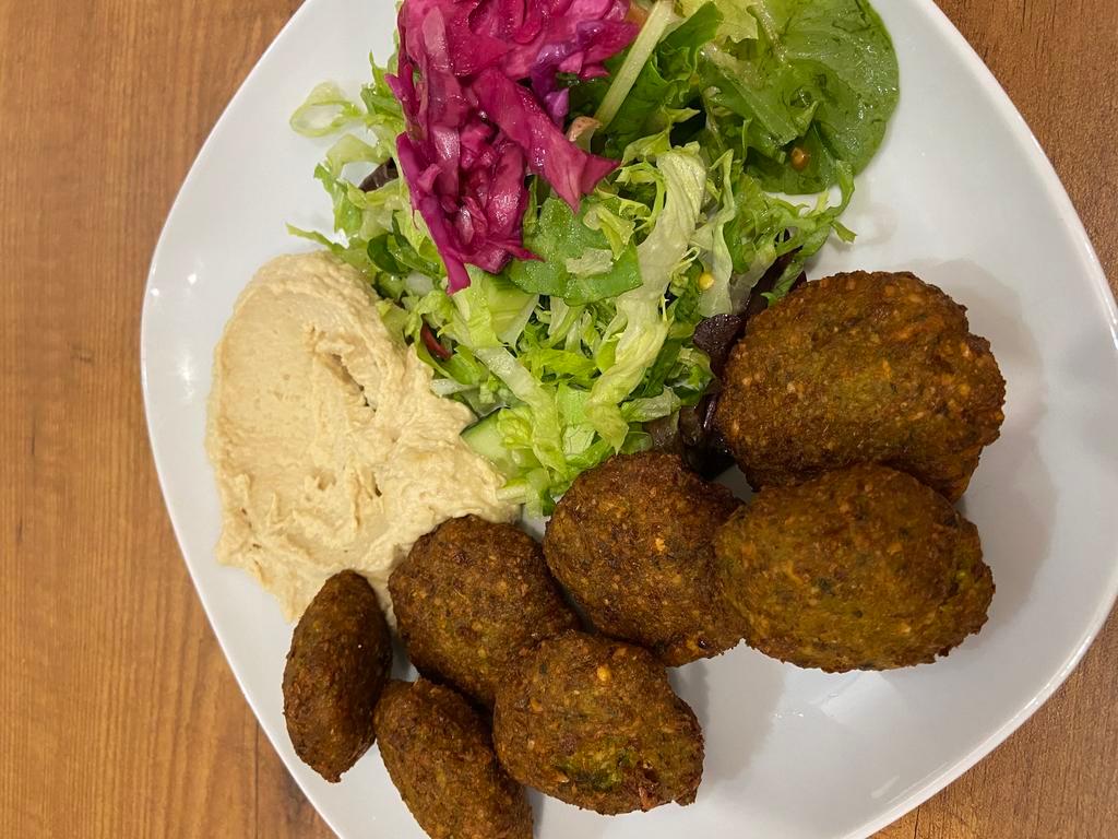 Falafel with Hummus · 7 pieces. Lightly fried vegetable balls made of chickpeas with celery, garlic parsley, cilantro, served with tahini sauce.
