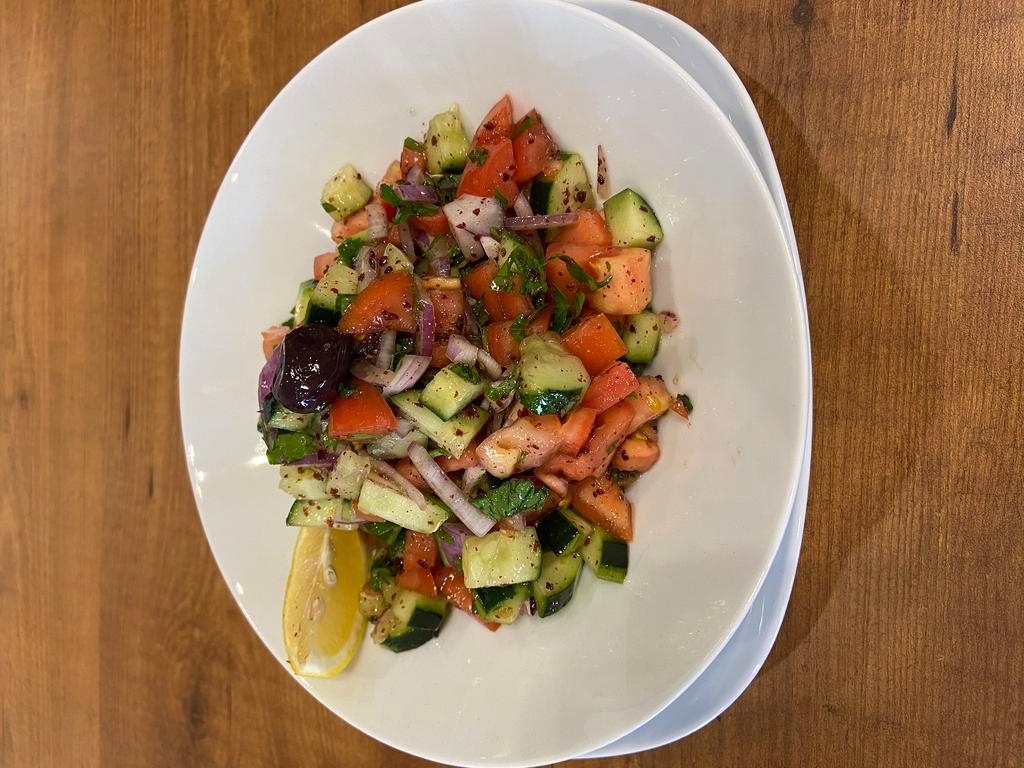 Shepherd's Salad · Coban salatasi. Fresh tomatoes, kirby, green peppers, onions, parsley, olive oil, and lemon juice.