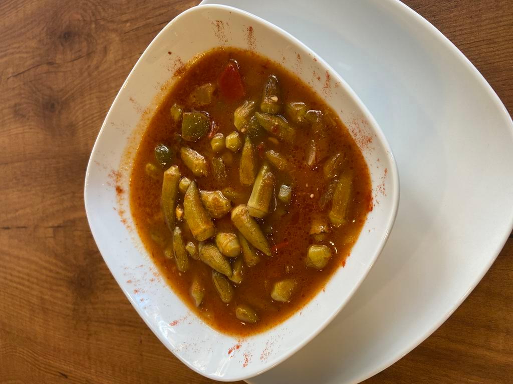 Okra · Okras stewed in tomato. Served with rice.