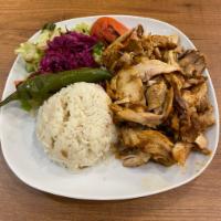 Chicken Gyro · Layers of marinated chicken thighs wrapped around large vertical split and grilled in front ...