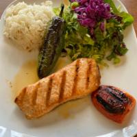 Grilled Salmon · Char-grilled salmon served with salad and rice.