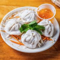 Prok Steamed Dumplings (4pc) · Made with pork, garlic, chives, soy sauce, sesame oil, and ginger. Served w/ fish sauce vina...