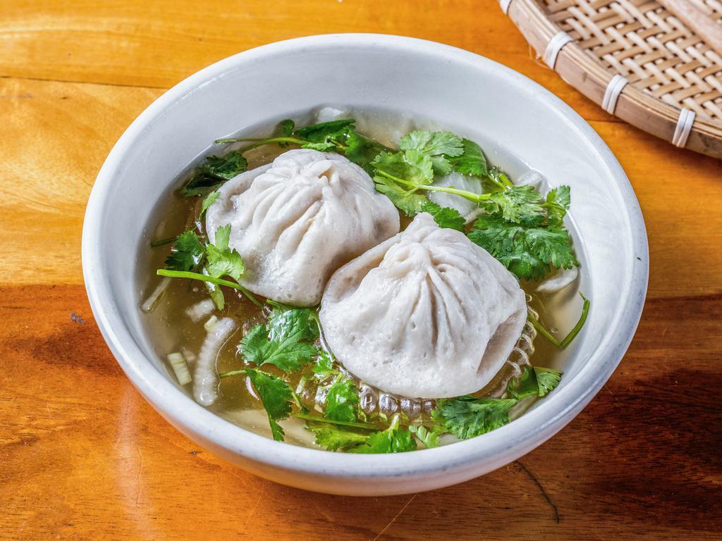 Pork Dumpling Soup (2 Pcs) · Made with pork, garlic, chives, soy sauce, sesame oil, and ginger. Served in our Beef Pho broth, topped with onions and cilantro.