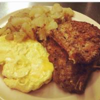 Pork Chops and Eggs Breakfast · 2 eggs any style, 2 breaded crispy chops, home potatoes and toast. Add cheese for an additio...