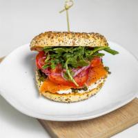 Salmon Lox · Cured salmon, cream cheese, capers, red onion, arugula, and tomato on a bold everything bage...