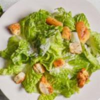 Caesar Salad · Crispy Romaine Lettuce, Tossed in a Creamy Parmesan Caesar Dressing, Topped with Homemade Ga...