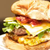 Classic Egg Burger · Fried egg, bacon, lettuce, pickle, American cheese, mayo, and mustard.