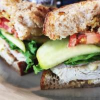 S3. Turkey Brie · Smoked turkey, Brie cheese, sliced green apple, lettuce, tomato, and honey mustard.