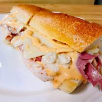 S17. TC Sandwich · Oven roasted turkey, corned beef, coleslaw, and Russian dressing.