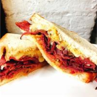 G11. Pastrami Nightmare · Pastrami, melted Swiss cheese, grilled onion, tomato, and mustard on a toasted hero or wrap.