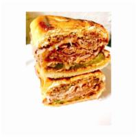 G14. Cuban Combo · Grilled ham, grilled roasted pork, pickle, melted Swiss cheese, and mustard on a toasted her...